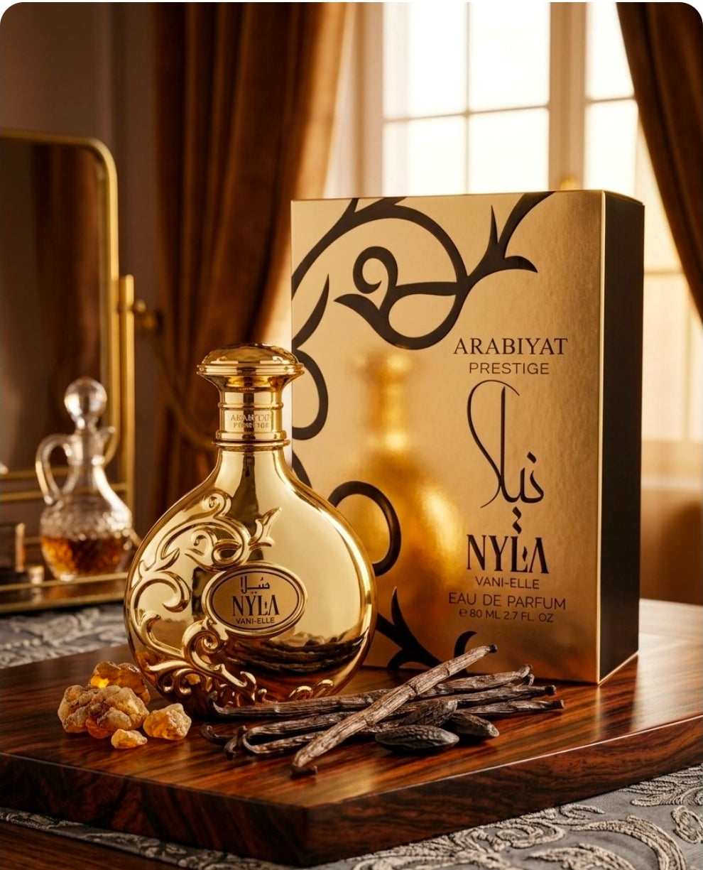 Nyla Vani-Elle de Arabiyat Prestige.Caramelo (Caramel) y Ámbar (Amber). Es el cuerpo del perfume, el cual le otorga ese aroma dulce, cálido y sumamente gourmand. Unisex
